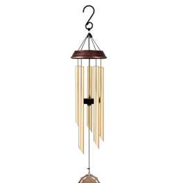 Hanging metal wind chime with gold tubes and a decorative medallion
