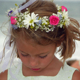 Girl wearing a floral crown with pink and white flowers
