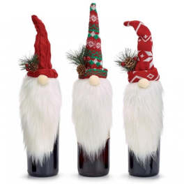 Three Christmas gnome bottle toppers with red hats and white beards