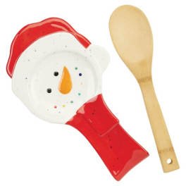 Ceramic snowman spoon rest and wooden spoon on a white background