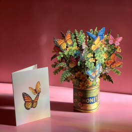 Butterfly-themed paper bouquet in a honey tin with a matching card
