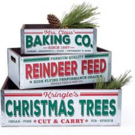 Stacked wooden crates with holiday text and pine sprigs