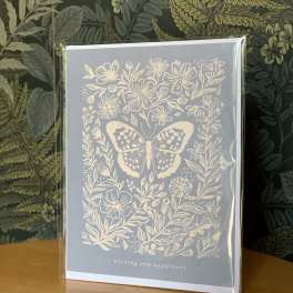 Greeting card with a butterfly and floral illustration