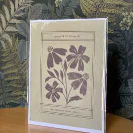 Greeting card with purple floral illustration and the words "growth is growth"