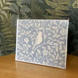 Decorative greeting card with a bird and floral pattern