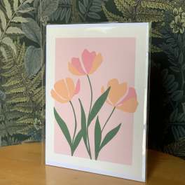 Framed floral print with pink and orange tulip-like flowers