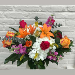 Mixed bouquet with orange lilies, roses, and white hydrangeas