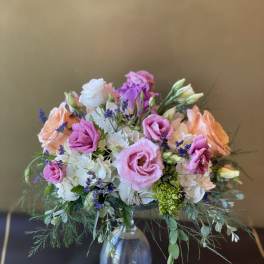 Pink and peach bouquet in a clear glass vase