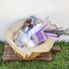 Gift basket with lavender-wrapped items and dried flowers