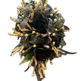 Black floral corsage with gold accents on a white background