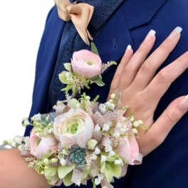 Corsage and boutonniere with pale pink and white flowers