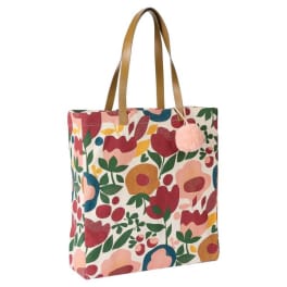 Floral-patterned tote bag with tan handles and a pink pom-pom charm