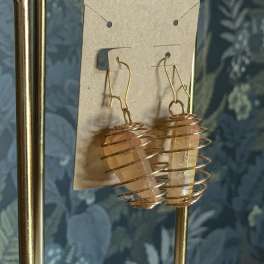 Pair of crystal point earrings on a display card