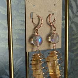 Pair of dangling crystal earrings with copper wire coils