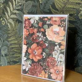 Floral greeting card with orange, pink, and white blossoms