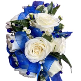 White rose bouquet with blue ribbon and small white filler flowers
