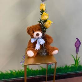 Teddy bear with yellow roses and a "It's a Boy" balloon