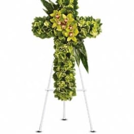 Green floral cross on a metal easel