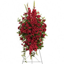 Tall red floral standing spray on an easel