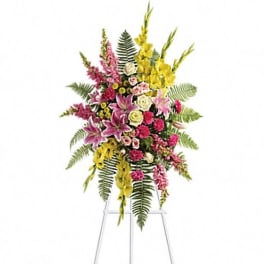 Tall standing floral spray with pink, yellow, and white flowers