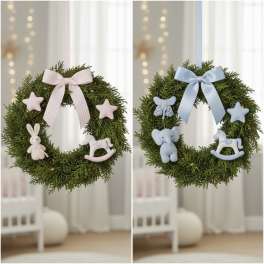 Two baby-themed evergreen wreaths with pastel bows and plush animal ornaments