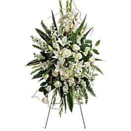 Tall white floral standing spray on an easel