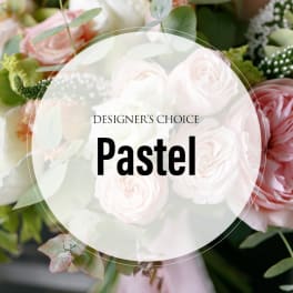 Pastel bouquet of pink and white roses with greenery