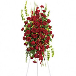 Tall red rose standing spray on a white easel