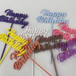 Colorful glitter birthday cake toppers with script text on sticks