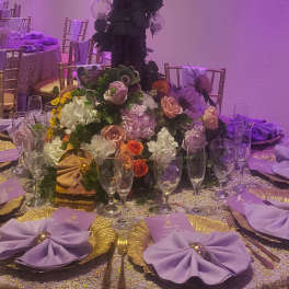 Elegant purple mix table center arrangement for special events