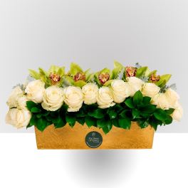 Cream roses and green orchids in a gold rectangular box
