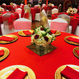 Elegant center table arrangement red roses with hydrangeas