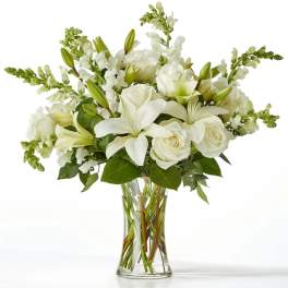 White floral bouquet in a clear glass vase