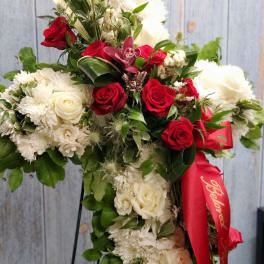 Standing floral spray with red and white roses and chrysanthemums
