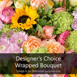 Mixed bouquet with a sunflower, roses, and pastel blooms
