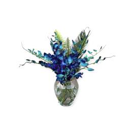 Blue orchid arrangement in a clear glass vase