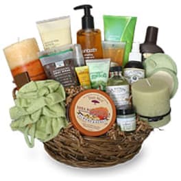 Spa gift basket with candles and bath products in a wicker basket