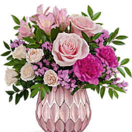 Pink roses and alstroemeria in a pink textured vase
