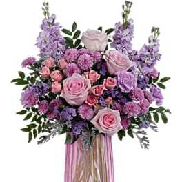 Pink and lavender bouquet in a pink glass vase