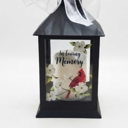 Black memorial lantern with a white bow and "In loving Memory" design