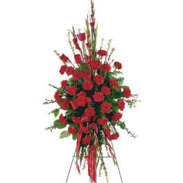 Tall red floral standing spray on an easel
