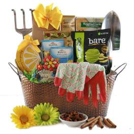 Gift basket with gardening tools, seeds, gloves, and snacks