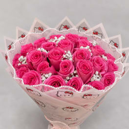 Bouquet of bright pink roses wrapped in Hello Kitty paper