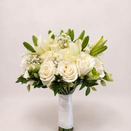 White rose and lily bridal bouquet with green buds and baby's breath