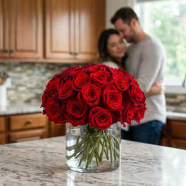 Bouquet of red roses in a clear glass vase