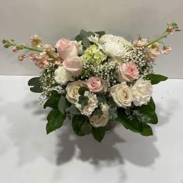 Blush and white rose bouquet in a glass vase