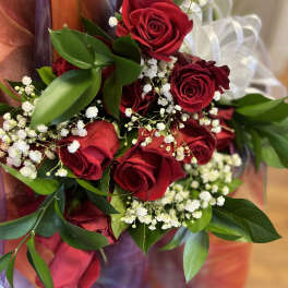 Bouquet of red roses with white baby's breath and greenery