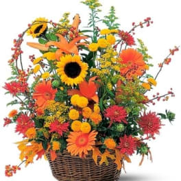 Basket arrangement with sunflowers, orange lilies, and gerbera daisies