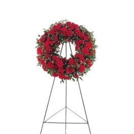Red floral wreath on a standing easel