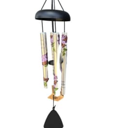 Black metal wind chime with floral-printed tubes and a bell